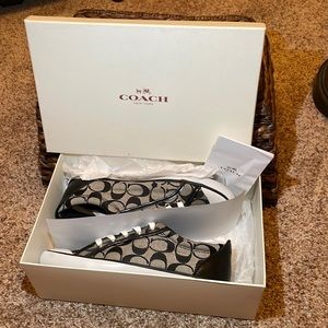 New in box. Coach black and grey signature sneakers.